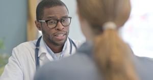 Close up of health care professional speaking towards patient