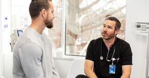Doctor and patient sitting down having a conversation