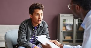 Male patient talking with doctor