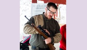 Gun safety instructor explaining gun safety