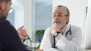 Senior doctor consulting patient